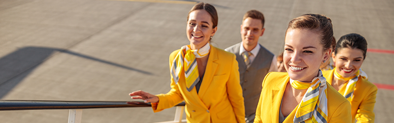 Flight attendants boarding via stairs